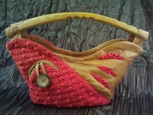Leather bag in a crochet combination and wooden carrying handle/varga.halec/flickr